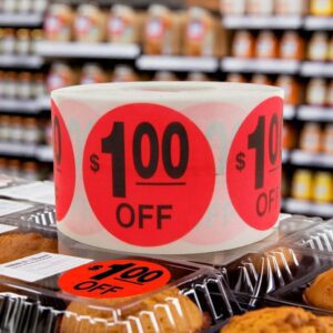 $1.00 off label red circle sticker with text that reads $1.00 off in use in bakery