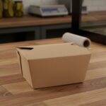 Small paperboard takeout container sitting on deli counter