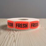 fresh sticker on a bright red dayglo label