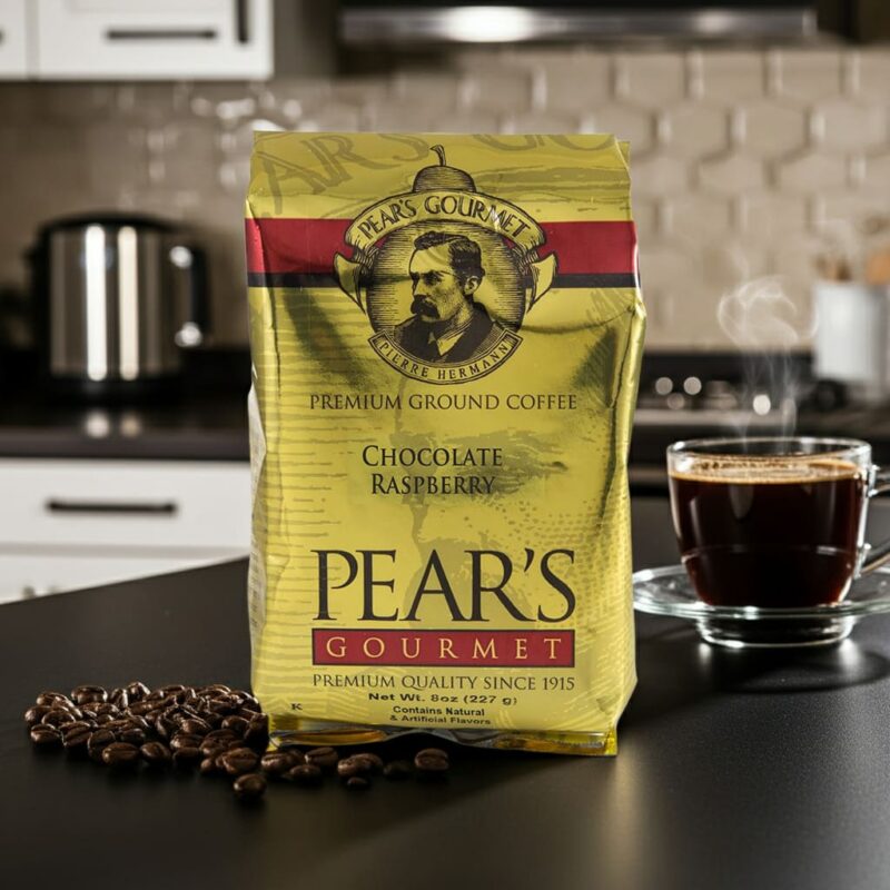 Pears Coffee Chocolate Raspberry 8oz next to coffee