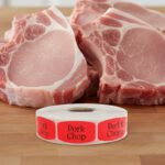 pork chop sticker on a red label with black text