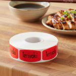 teriyaki sticker on a red label with black text